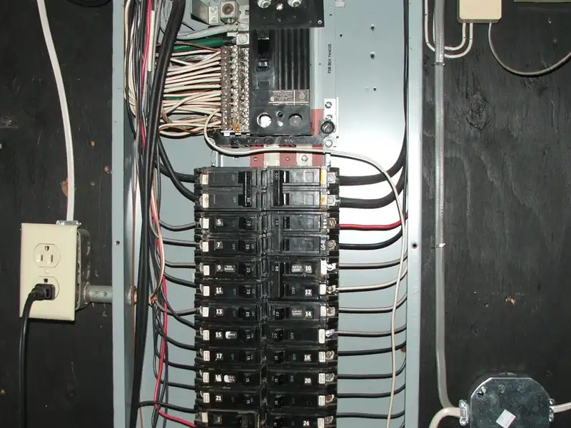 Residential GE breaker panel with the wiring visible