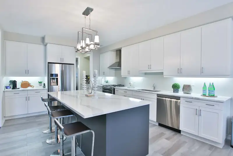 Modern kitchen with recessed and pendant lighting